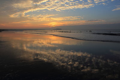 Scenic view of calm sea at sunset