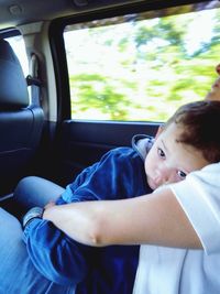 Man sleeping in car