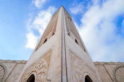 Low angle view of mosque hassan ii against sky in city