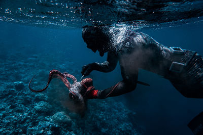 Person swimming in sea