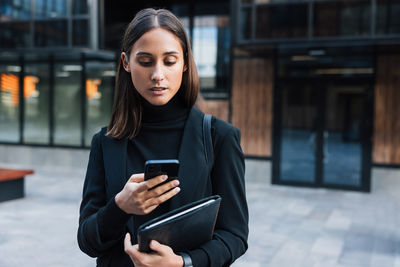 Young woman using mobile phone