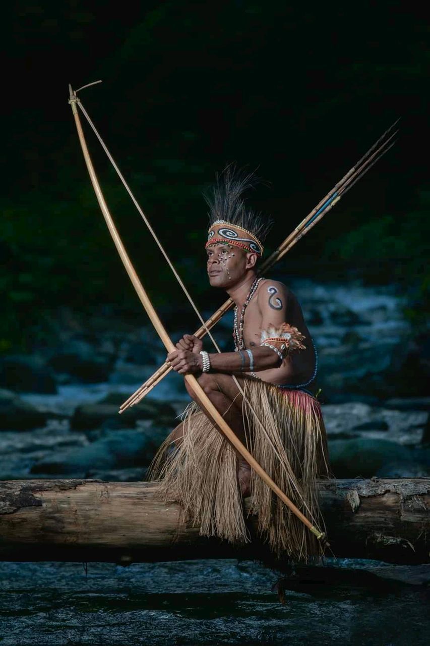 nautical vessel, water, nature, adult, one person, weapon, oar, clothing, screenshot, holding, outdoors, traditional clothing, boat, fantasy, history, warrior, archery, river