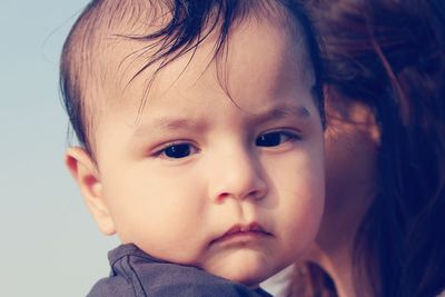 Cropped image of mother with toddler son during winter