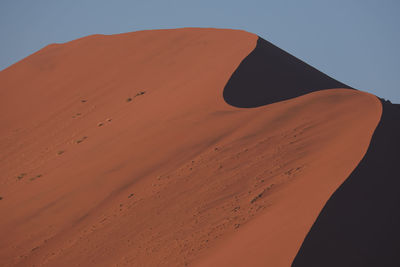 Scenic view of desert against clear sky