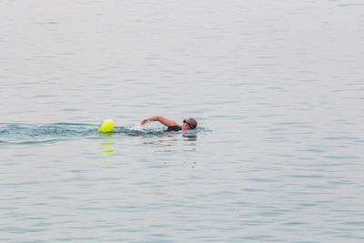 Portrait of men swimming in sea