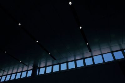 Low angle view of illuminated lights in building