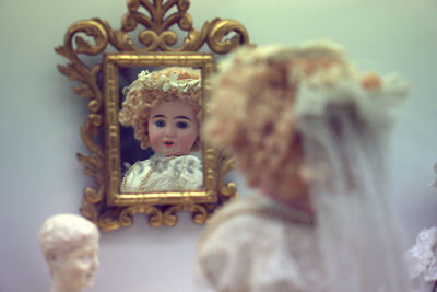 Reflection of doll in mirror