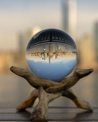 Close-up of crystal ball on glass