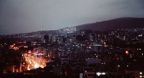 Aerial view of city lit up at night