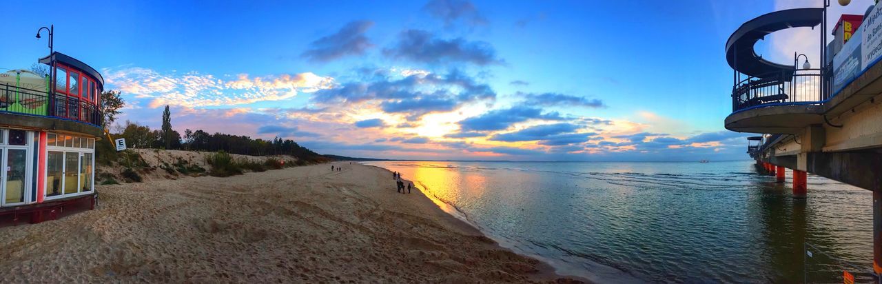 sea, beach, water, horizon over water, sky, sand, sunset, nature, beauty in nature, cloud - sky, vacations, outdoors, scenics, tranquility, tranquil scene, no people, building exterior, architecture, day