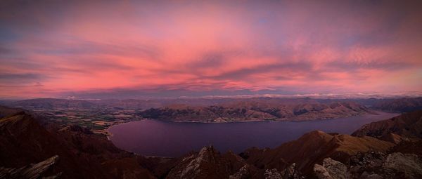 Scenic view of mountains against sky at sunset