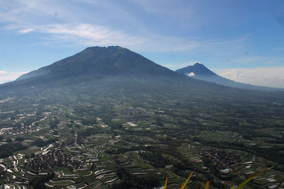 Aerial view of volcanic landscape against sky