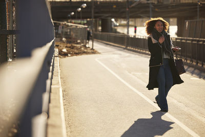 Young woman walking on street