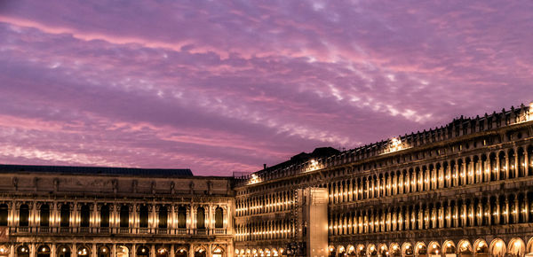 Low angle view of illuminated piazza san marco at dusk
