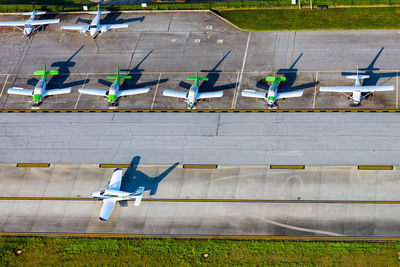 An airplane taxis in front of several parked planes at pdk airport in atlanta 