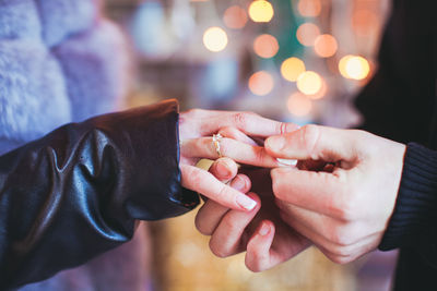 Close-up of couple holding hands