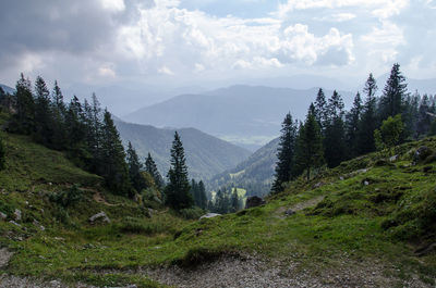 Scenic view of mountains against cloudy sky