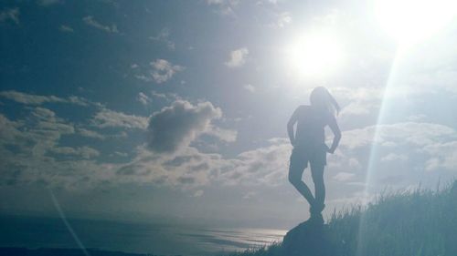 Man in sea against sky