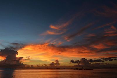 Scenic view of silhouette land against sky during sunset