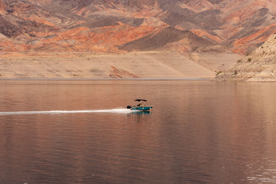 People kayaking in lake