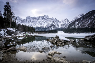 Scenic view of snow covered mountains against sky