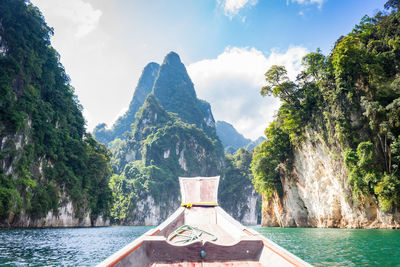 Scenic view of sea and mountains against sky