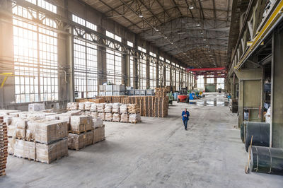 Manager walking through factory hall