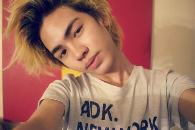 Close-up portrait of smiling young woman