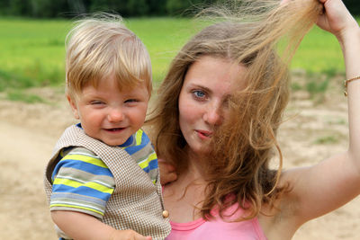 Portrait of mother and daughter outdoors