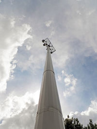 Low angle view of communications tower against sky