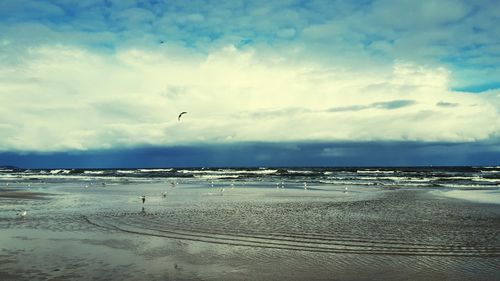 Scenic view of beach against sky