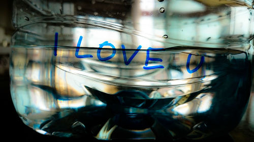 Close-up of i love you text on water bottle