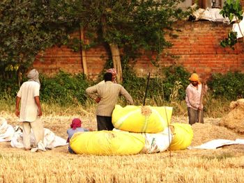 Men lying on ground