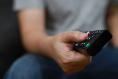 Close-up of man using mobile phone