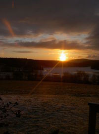 Scenic view of landscape at sunset