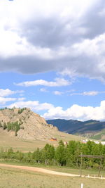 Scenic view of landscape and mountains against sky