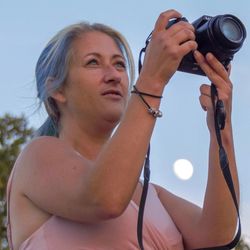 Portrait of woman photographing