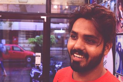 Close-up portrait of smiling mid adult man