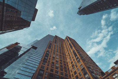 Low angle view of modern buildings against sky