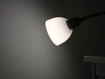 Low angle view of illuminated lamp