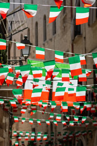 Multi colored flags hanging in row