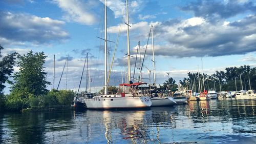 Boats moored at harbor