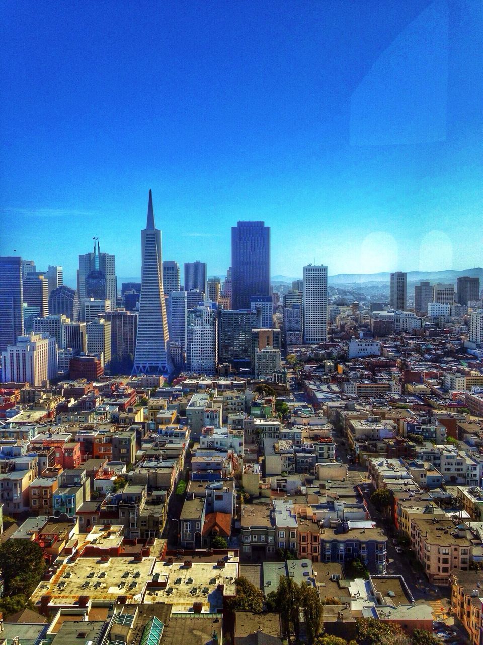 building exterior, city, cityscape, architecture, built structure, skyscraper, clear sky, blue, tower, crowded, tall - high, office building, urban skyline, copy space, modern, high angle view, capital cities, city life, financial district, residential district