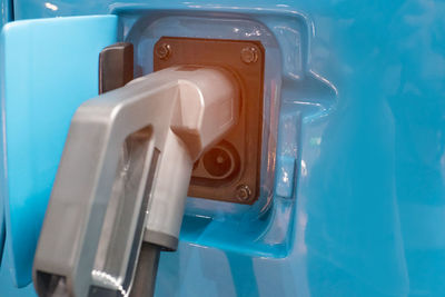 High angle view of bottle on blue wall