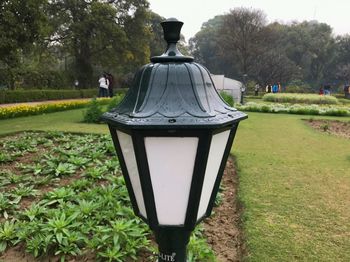 Close-up of electric lamp in park