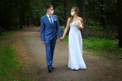 Full length of mother and daughter in park