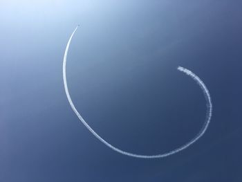 Low angle view of vapor trails in sky