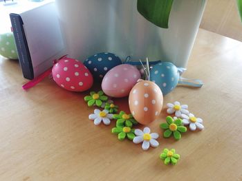 Easter eggs and flower decorations on table at home