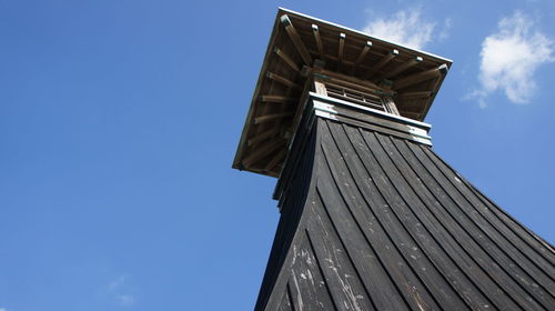 Low angle view of built structure against blue sky