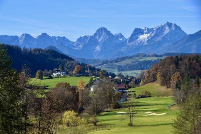 Scenic view of landscape and mountains against sky